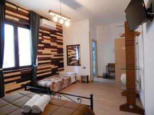 A television and/or entertainment centre at Camurria Sicilian B&B