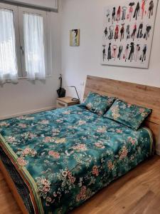 Postel nebo postele na pokoji v ubytování B&B Vegan La Mucca felice - Grazioso appartamento nel verde