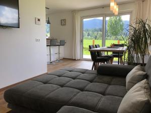 a living room with a couch and a table at Haus Johanna in Westendorf