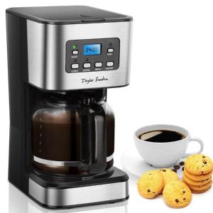 a coffee maker with cookies and a cup of coffee at RIVER SIDE near FRANKFURT ----- STAY LIKE AT HOME ----- in Hainburg