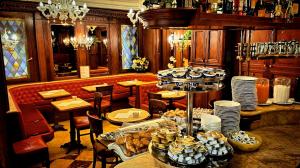 a restaurant with a table with food on it at Hotel Lux in Venice