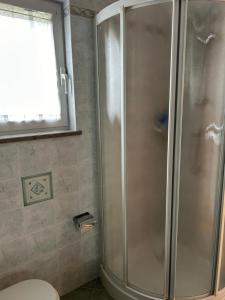 Koupelna v ubytování Ai 2 Olmi - monolocali nel verde