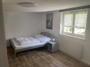 Ένα ή περισσότερα κρεβάτια σε δωμάτιο στο Ferienwohnung Wenzel