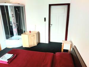 Llit o llits en una habitació de Gasthof Oberschmiede