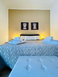 Giường trong phòng chung tại Casa Akragas