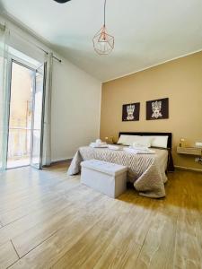 Giường trong phòng chung tại Casa Akragas