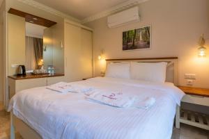 Postel nebo postele na pokoji v ubytování HOTEL DALYANCE
