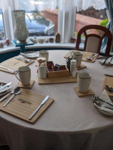 a table with plates and utensils on top of it at Hesketh Hotel in Blackpool