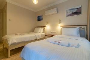 Postel nebo postele na pokoji v ubytování HOTEL DALYANCE