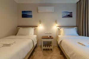 Postel nebo postele na pokoji v ubytování HOTEL DALYANCE