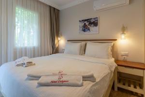 Postel nebo postele na pokoji v ubytování HOTEL DALYANCE