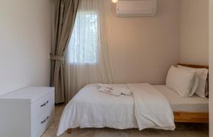 Postel nebo postele na pokoji v ubytování HOTEL DALYANCE