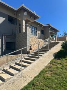 a house with stairs in front of it at Valley View in Mbabane