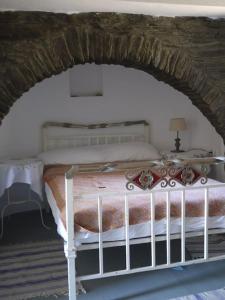 Postel nebo postele na pokoji v ubytování Andros Stone Sea View Villa
