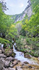 a stream in the mountains with a waterfall at B&B Fiume in Morino +68 photos