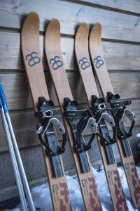 a group of skis leaning up against a wall at Arctic Nature Lodge in Inari