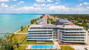 an aerial view of a large building next to the water at Coral Luxury Apartment in Siófok