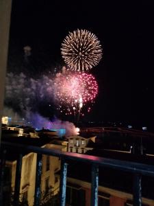 a firework display in the sky at night at Sunset Hotel Phu Quoc - welcome to a mixing world of friends in Phu Quoc