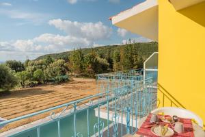 a balcony with a table and chairs and a view at Anastasia Studios Katelios in Katelios