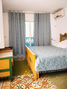 Säng eller sängar i ett rum på Maison Albatros