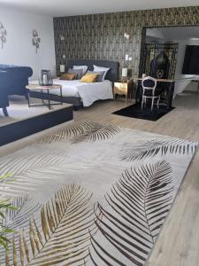 Ένα ή περισσότερα κρεβάτια σε δωμάτιο στο Le Domaine de La Tour des Vents