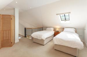 En eller flere senge i et værelse på Harthanger View Cottage, Luxborough