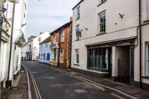 an empty street in a city with buildings at 48 Swain Street, Watchet in Watchet