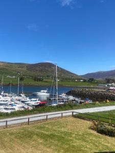 a group of boats docked in a marina at Picturesque Riverside Home in Cahersiveen