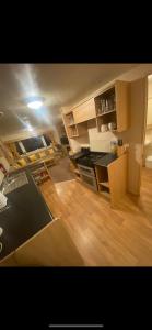 a kitchen with a stove and a counter top at Static Caravan Marine Holiday Park in Rhyl