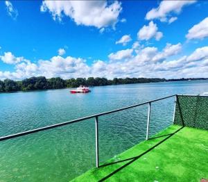 a boat on the water with a boat at Splav ostruznica in Belgrade