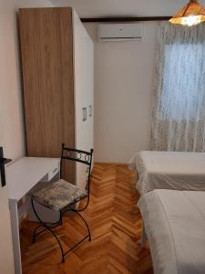 Łóżko lub łóżka w pokoju w obiekcie Buena Vida Apartman