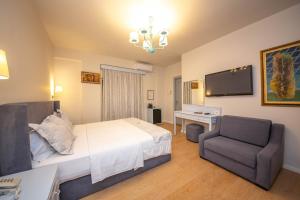 TV a/nebo společenská místnost v ubytování Illyrian Boutique Hotel
