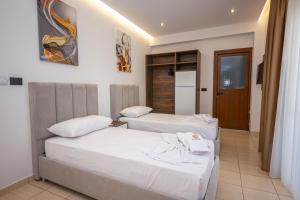 Postel nebo postele na pokoji v ubytování Hotel New Crystal