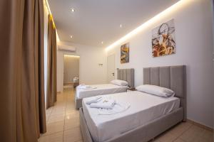 Postel nebo postele na pokoji v ubytování Hotel New Crystal