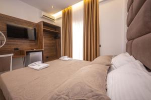 Postel nebo postele na pokoji v ubytování Hotel New Crystal
