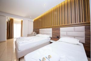 Postel nebo postele na pokoji v ubytování Hotel New Crystal