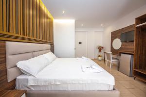 Postel nebo postele na pokoji v ubytování Hotel New Crystal