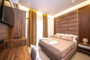 Postel nebo postele na pokoji v ubytování Hotel New Crystal