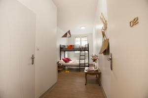 Postel nebo postele na pokoji v ubytování Le Flâneur Guesthouse