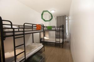 Postel nebo postele na pokoji v ubytování Le Flâneur Guesthouse