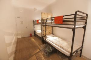 Postel nebo postele na pokoji v ubytování Le Flâneur Guesthouse