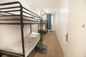 Postel nebo postele na pokoji v ubytování Le Flâneur Guesthouse