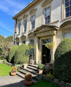 an old house with plants in front of it at Bowlish House in Shepton Mallet