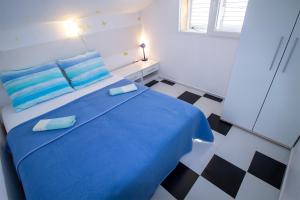 Postel nebo postele na pokoji v ubytování Villa Aurelia Vodice