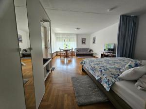 a bedroom with a bed and a living room at Miky Home in Calw