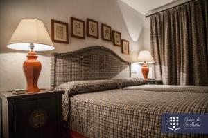 Postel nebo postele na pokoji v ubytování Hotel Boutique Casa de Orellana