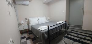 A bed or beds in a room at Chrisi Traditional House
