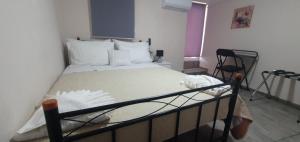 A bed or beds in a room at Chrisi Traditional House