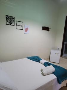 Brisa da Serra Hotel Pousada Pirenopolis客房内的一张或多张床位