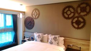 Letto o letti in una camera di Walker Hotel. Ximen